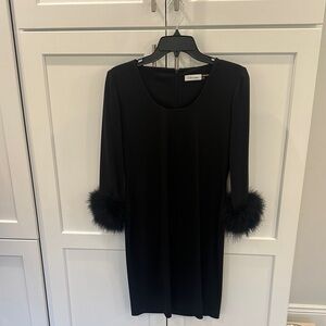 Calvin Klein Black Long Sleeve Dress with Feather Accented sleeves.